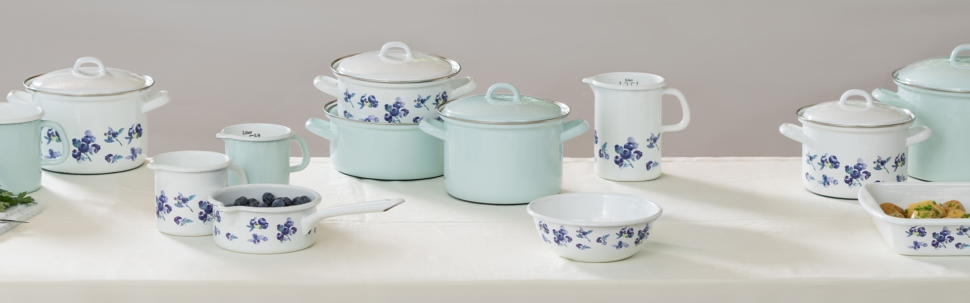 White enamel cookware with blue floral pattern
