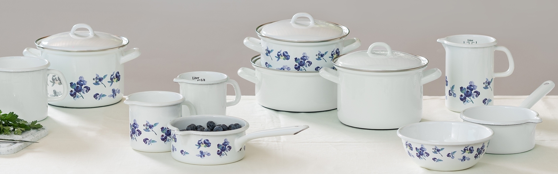White enamel cookware with blueberry pattern